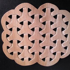 Carved trivet after scrolled
