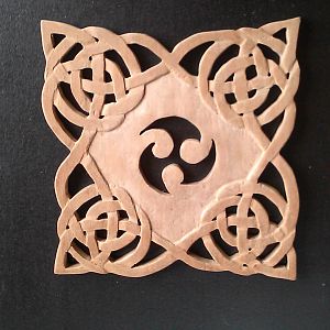Scrolled and carved trivet