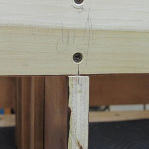 Attaching top supports to center divider