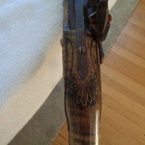tang carving Tom's rifle