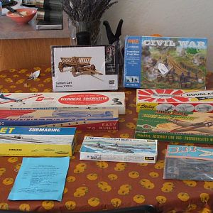 Collection of un-assembled model-kits, mostly wood