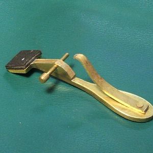 Teardrop key dismounted, showing pivot pin and spring