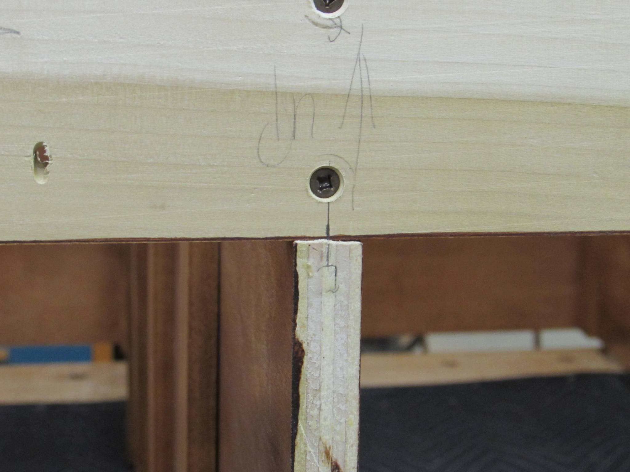 Attaching top supports to center divider