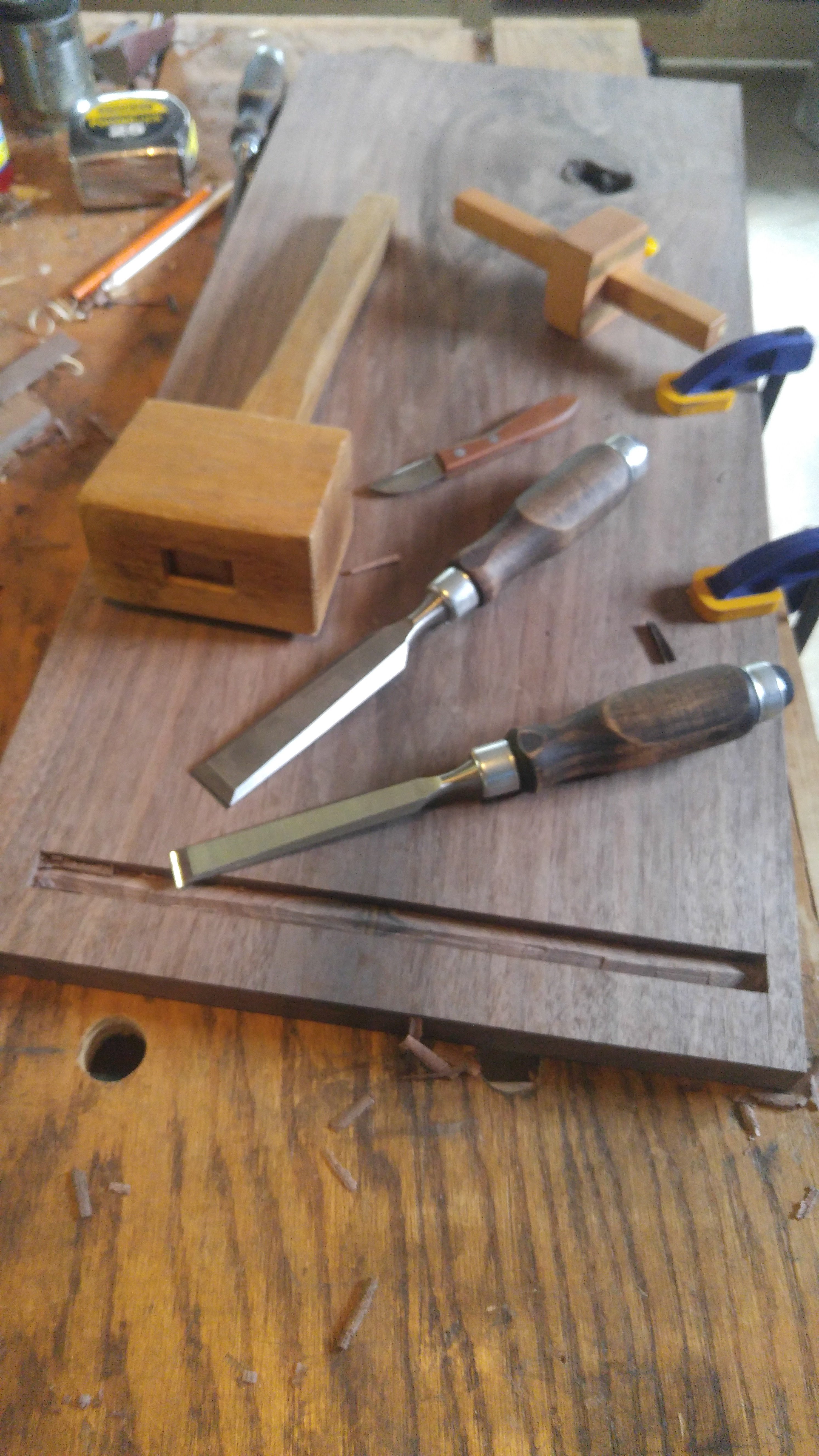 Cutting the mortise in the top, also, gratuitous chisel and mallet shot...