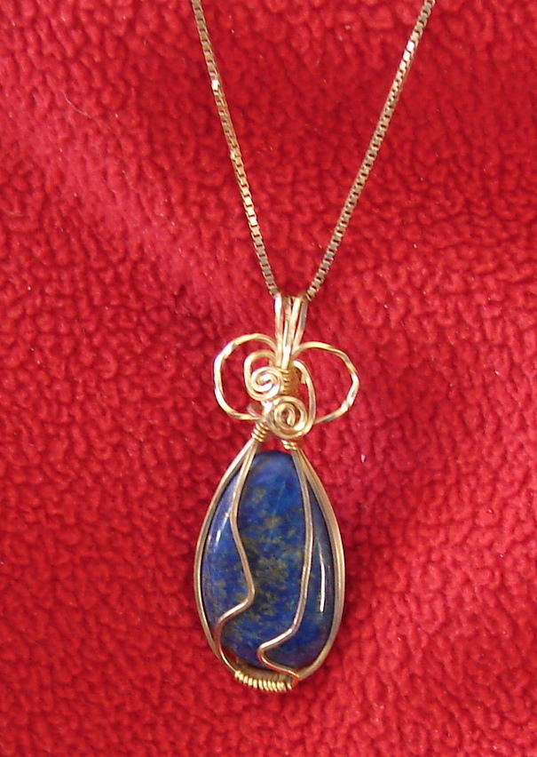 Lapis cabachon wrapped with gold wire